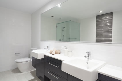 Large glass mirror in bathroom.